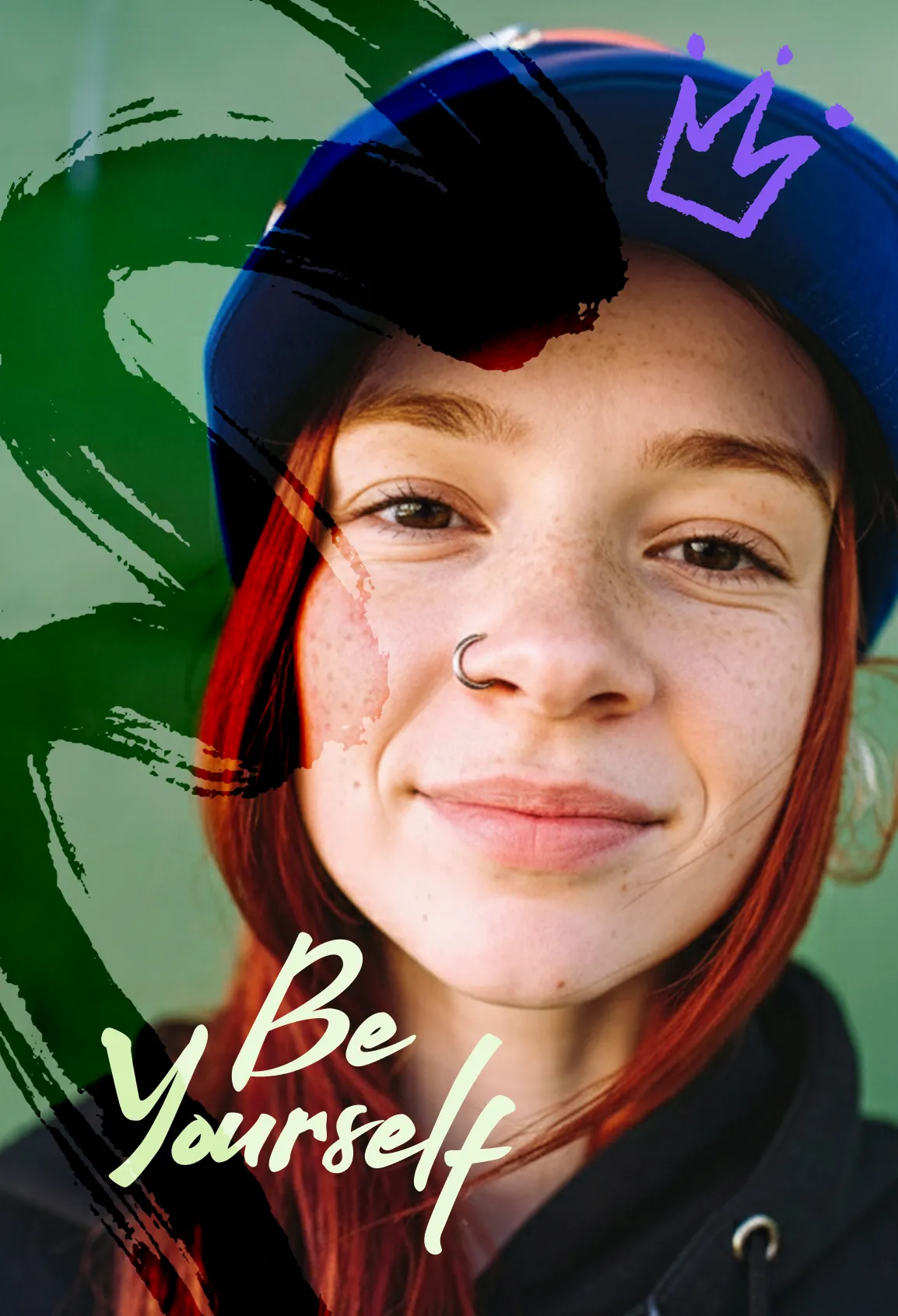 Portrait of a smiling young woman with red hair and freckles, wearing a blue cap and black hoodie, with green and black brushstroke overlays, a purple hand-drawn crown, and the text Be Yourself in cream script.
